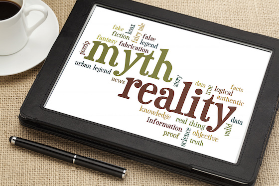 cloud of words or tags related to myth and reality on a  digital tablet
