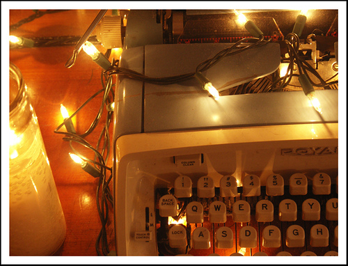 typewriter adorned with Christmas lights