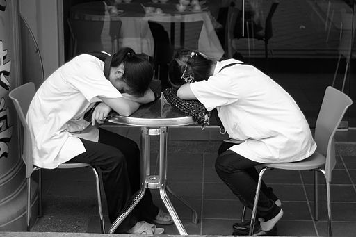 512px-Two_girls_are_sleeping_on_a_table