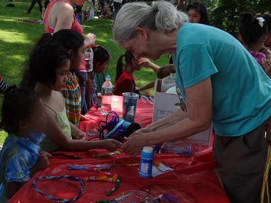 AOBC making bracelets with kids