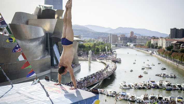 Red Bull Cliff Diving in Bilbao on 14 September 2019 from the Zubizuri near the Guggenheim. Image: #RedBullCliffDiving
