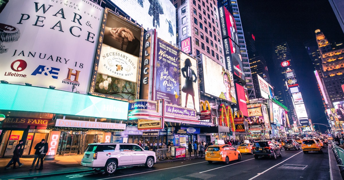 City street with billboards featuring mock up of book covers.