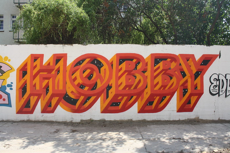 graffiti on a wall, displaying the word "hobby"