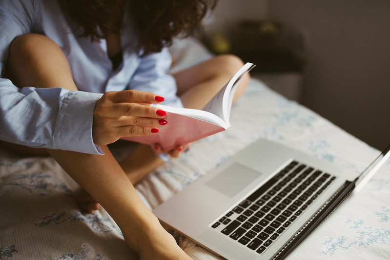 Woman writing in bed