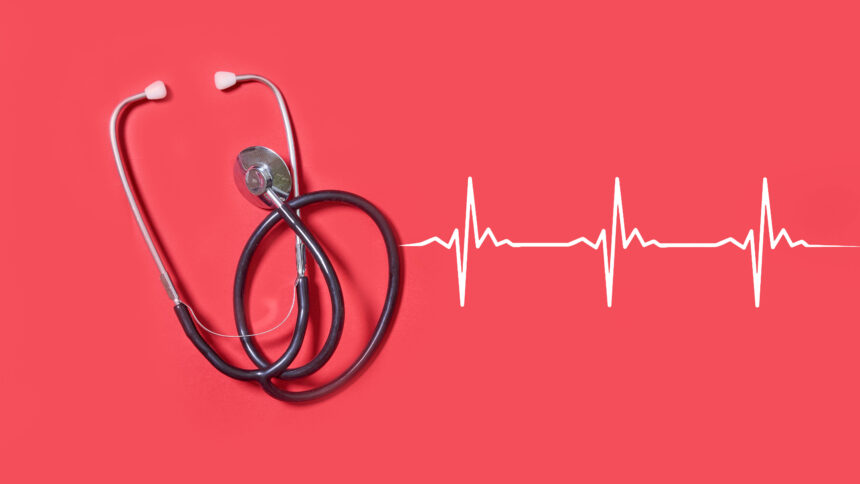 Stethoscope and heartbeats on red