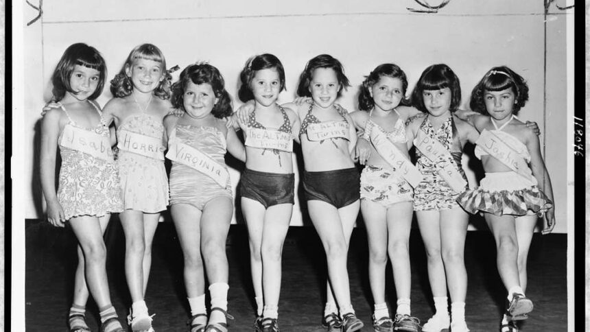A line of little girls in a beauty contest from the 1960s.