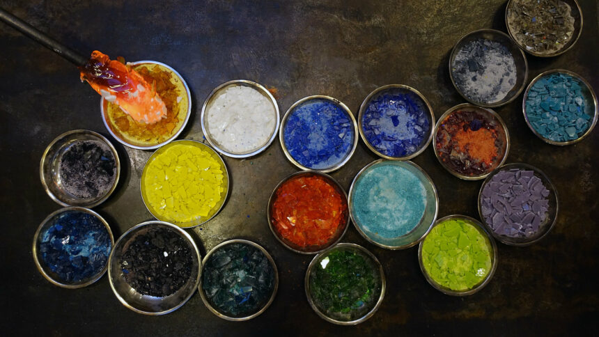 This photo shows colorful glass chips (one color per bowl) that a glass blower will use to create something beautiful.