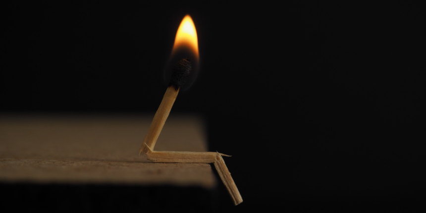 match head burning, positioned as if a sitting person