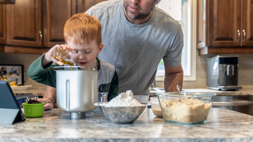 Photo of boy measuring ingredients for bread machine