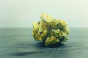 Photo of crumpled piece of paper with handwriting on it by Steve Johnson on Unsplash