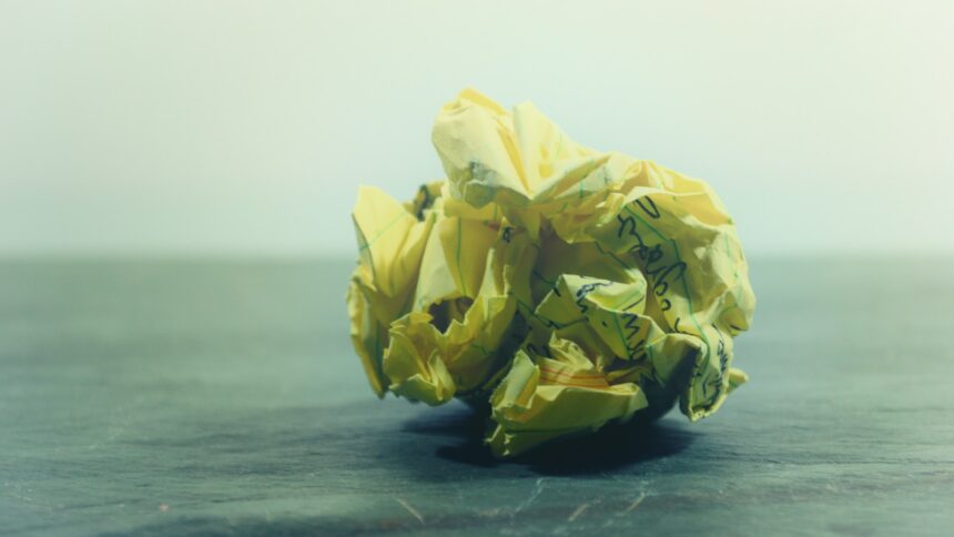 Photo of crumpled piece of paper with handwriting on it by Steve Johnson on Unsplash