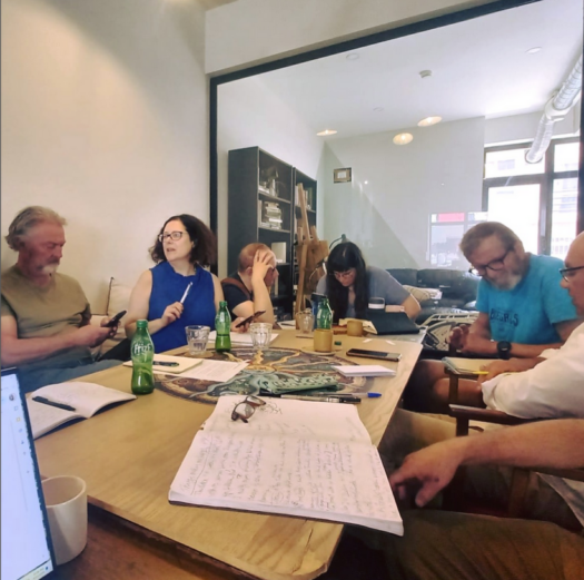 Writers around a table at a writing group