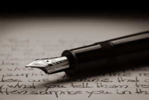 Header image: Fountain pen lying on a written page