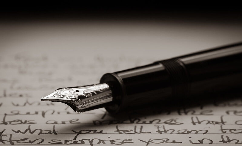 Header image: Fountain pen lying on a written page